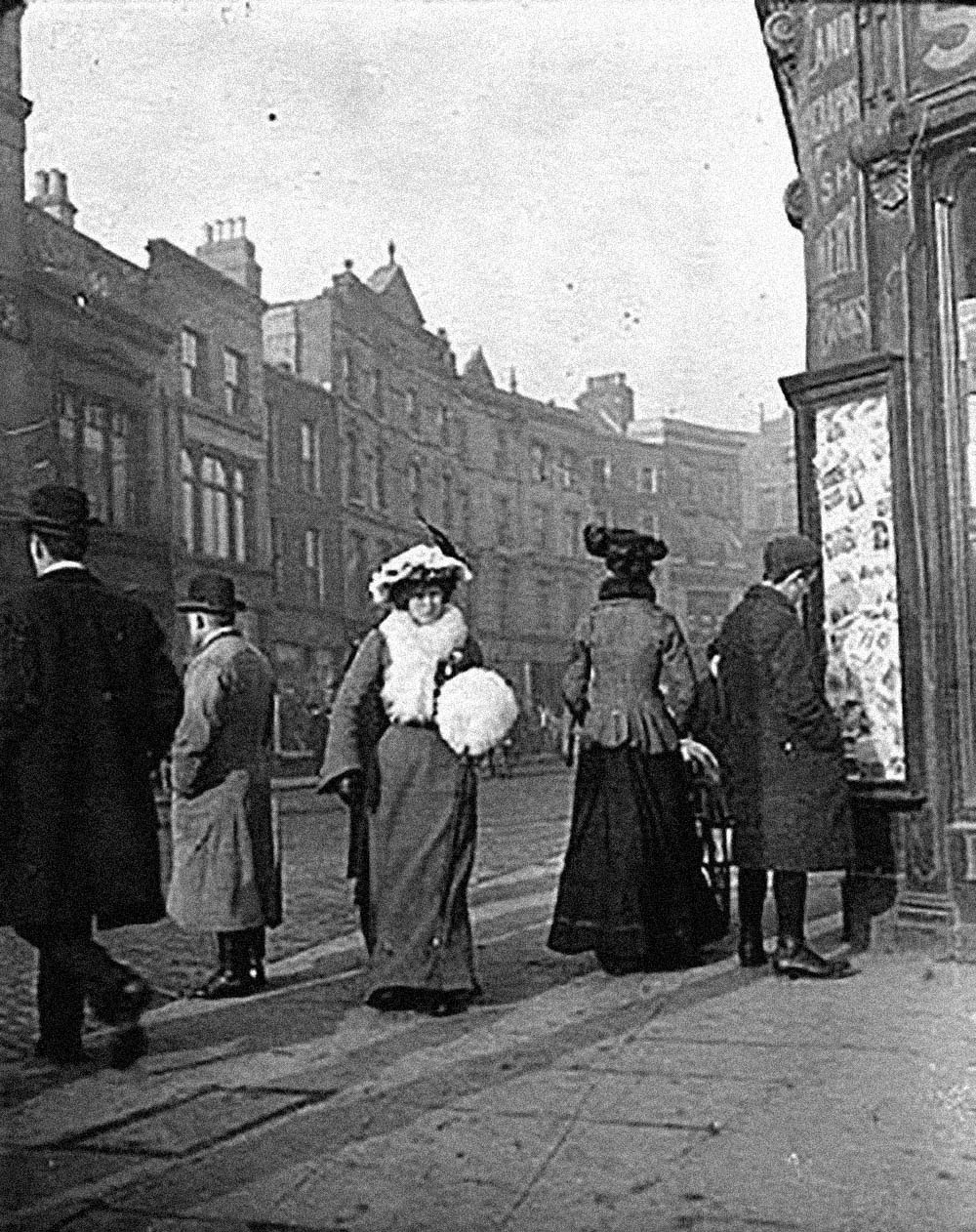 Contemporary Dublin street life: Woman with white muff walking on Grafton Street